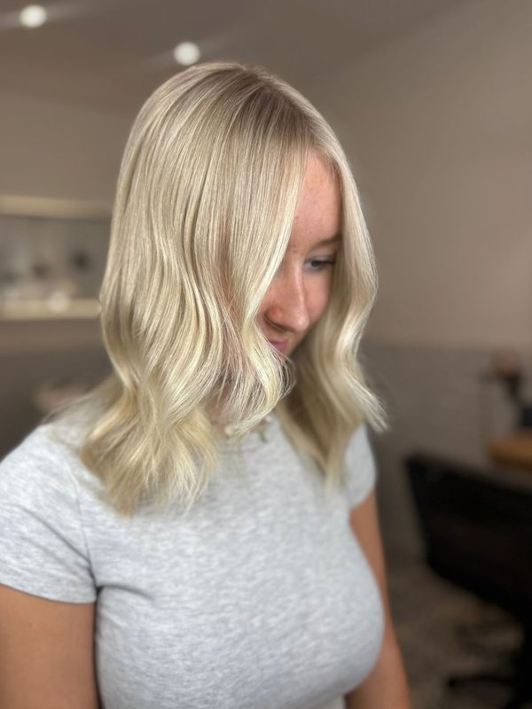 Soft blonde lob with a gentle wave, by Ellie