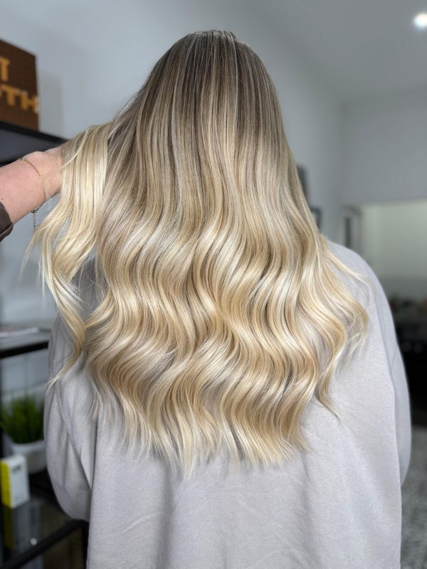 Bright blonde waves from behind, by Holly